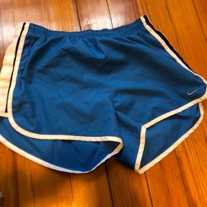 Blue Nike running shorts